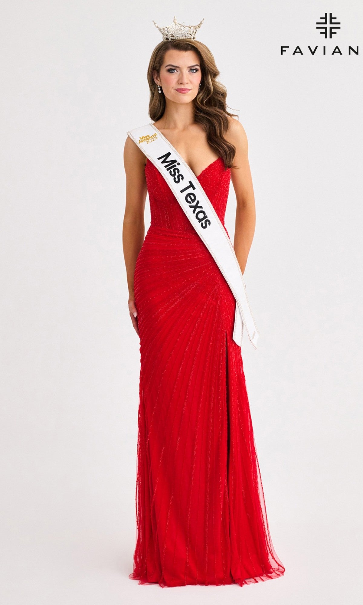 A woman in a red strapless long dress, wearing a crown and